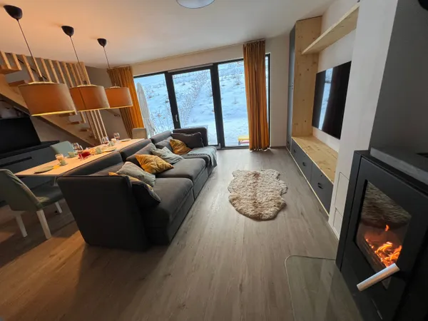 Living room with fireplace and mountain views