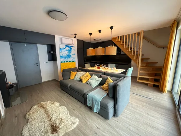 Living room with staircase to upper floor