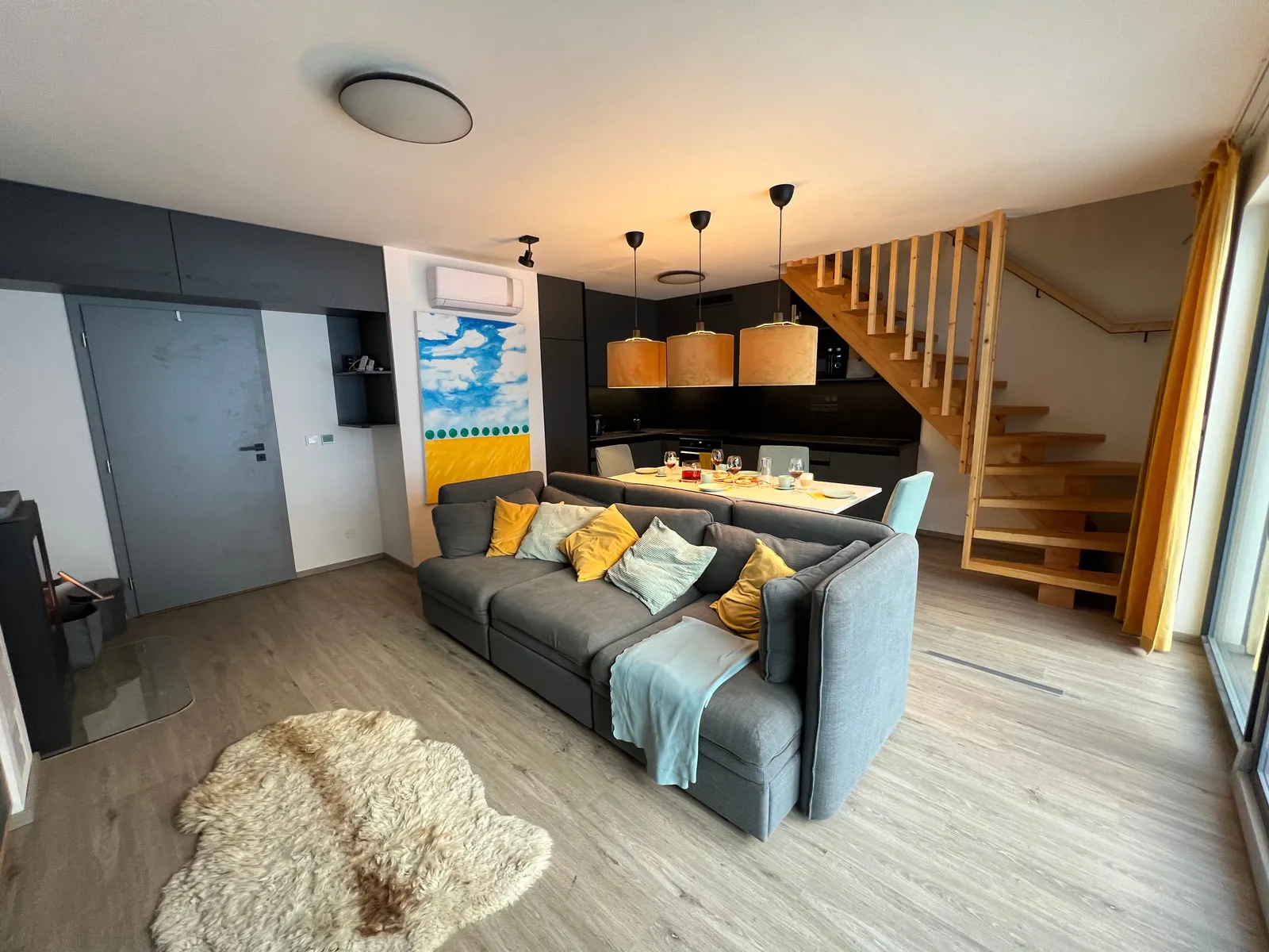 Living room with staircase to upper floor